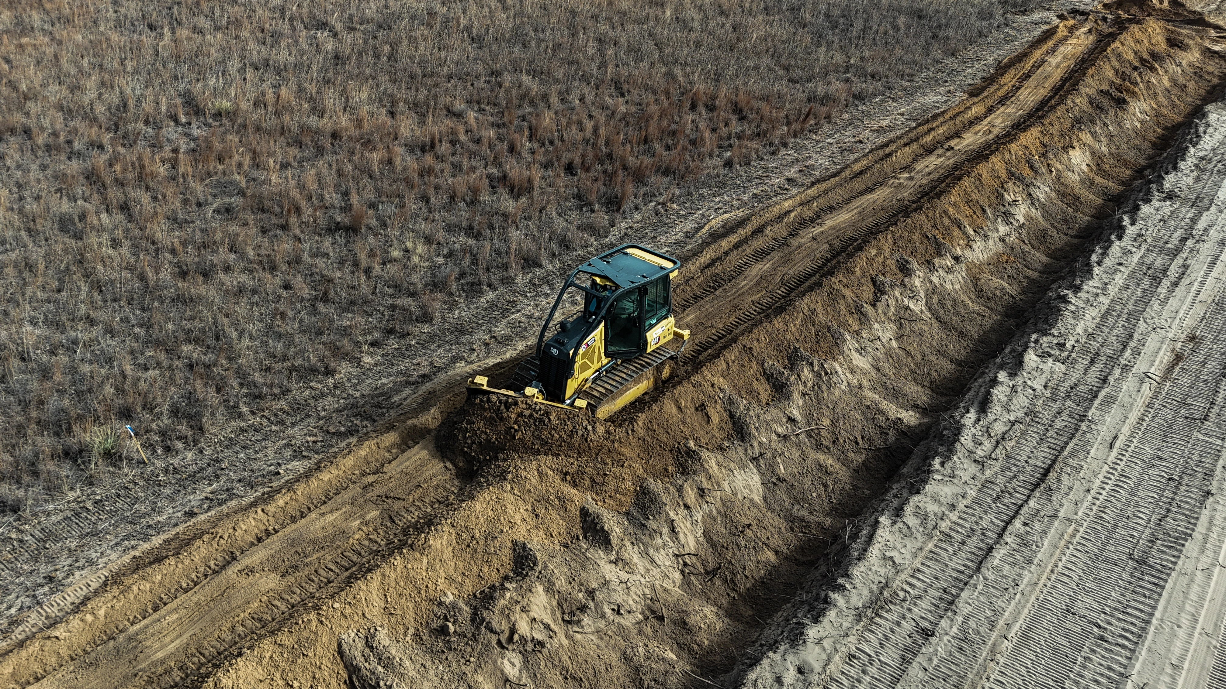Excavator Working on Pipeline Trench